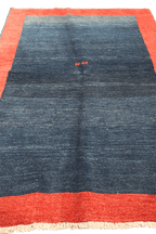 A traditional Gabeh Tribal Wool Rug
