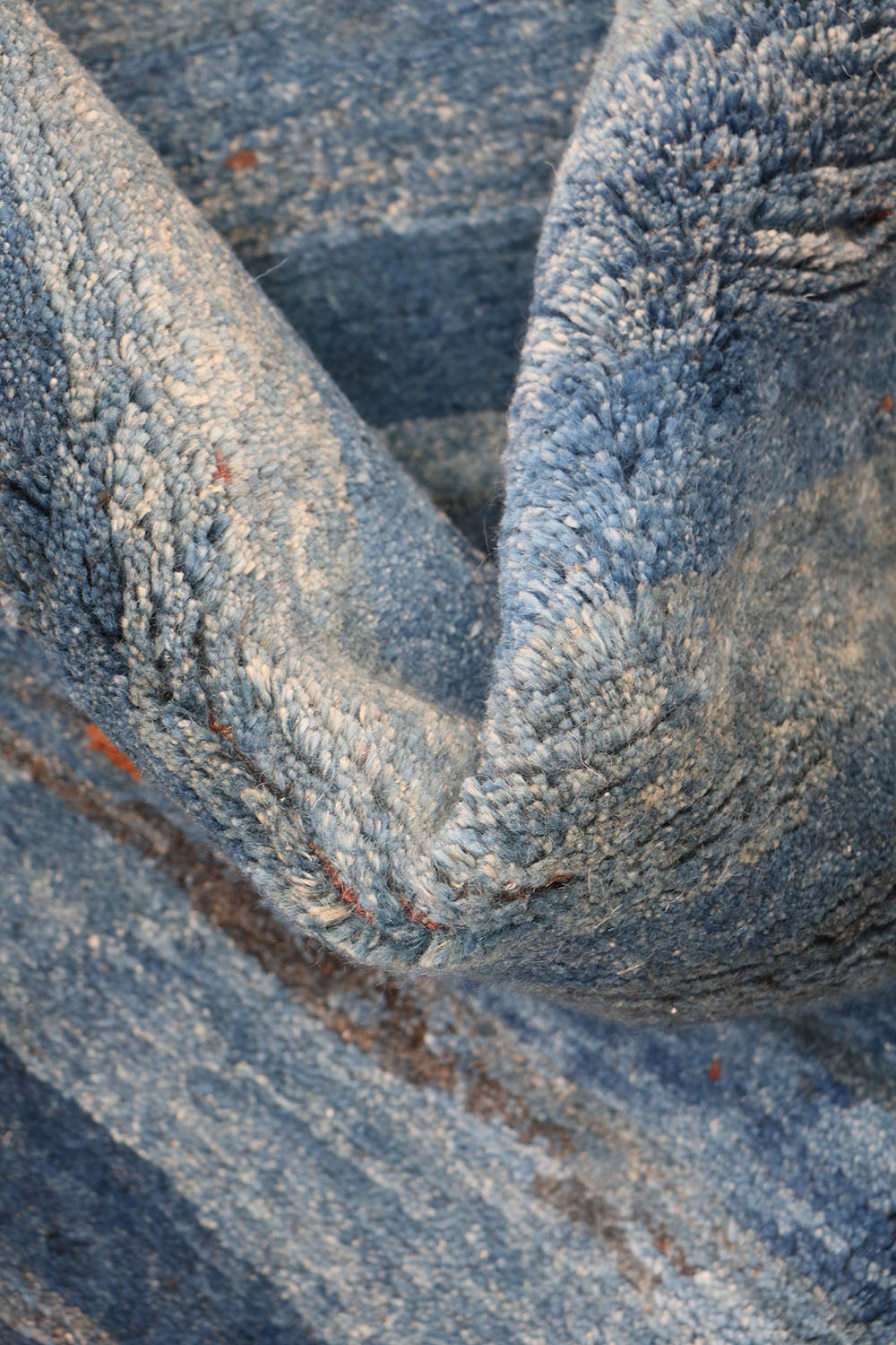 A vertical image of a Gabbeh Runner Tribal Wool Rug