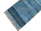A vertical image of a Gabbeh Runner Tribal Wool Rug
