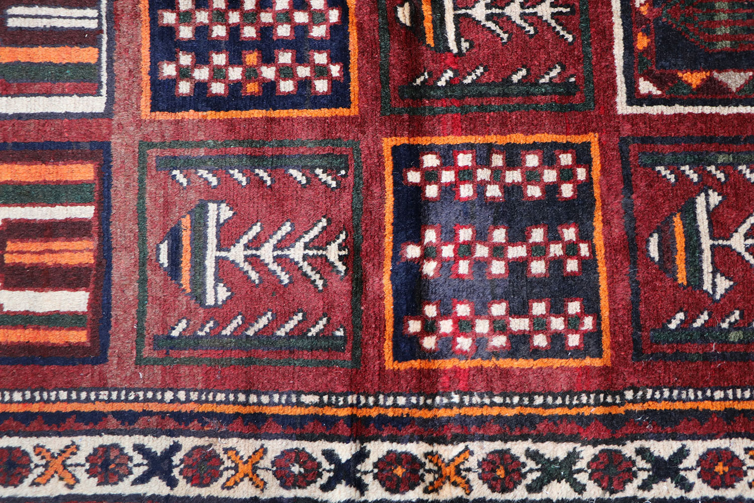 A hand-knotted Persian Qashqai Tribal Wool Rug