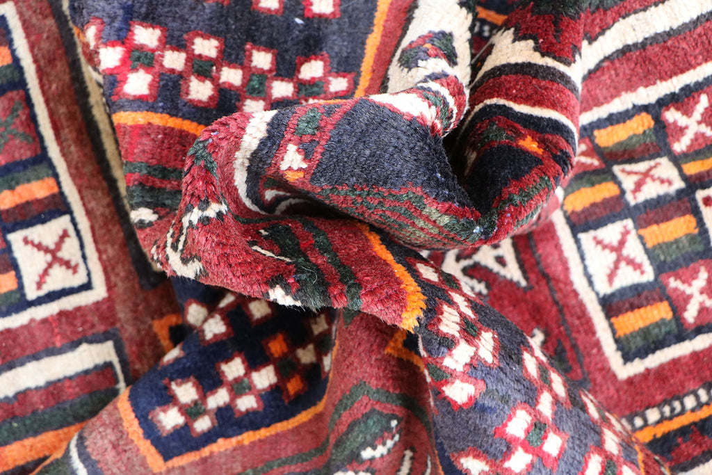 A hand-knotted Persian Qashqai Tribal Wool Rug