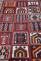 A hand-knotted Persian Qashqai Tribal Wool Rug