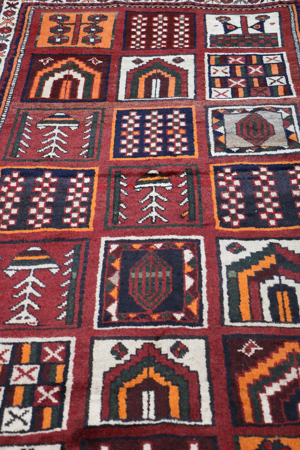 A hand-knotted Persian Qashqai Tribal Wool Rug