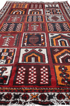 A hand-knotted Persian Qashqai Tribal Wool Rug