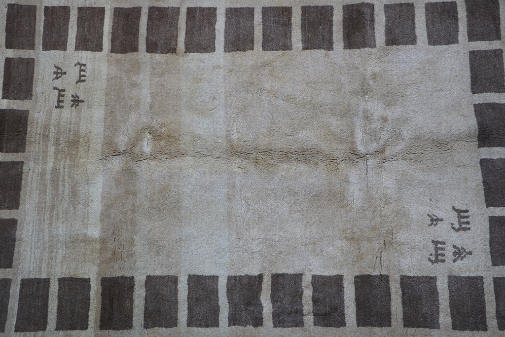 A rectangular Persian Gabbeh Tribal wool rug