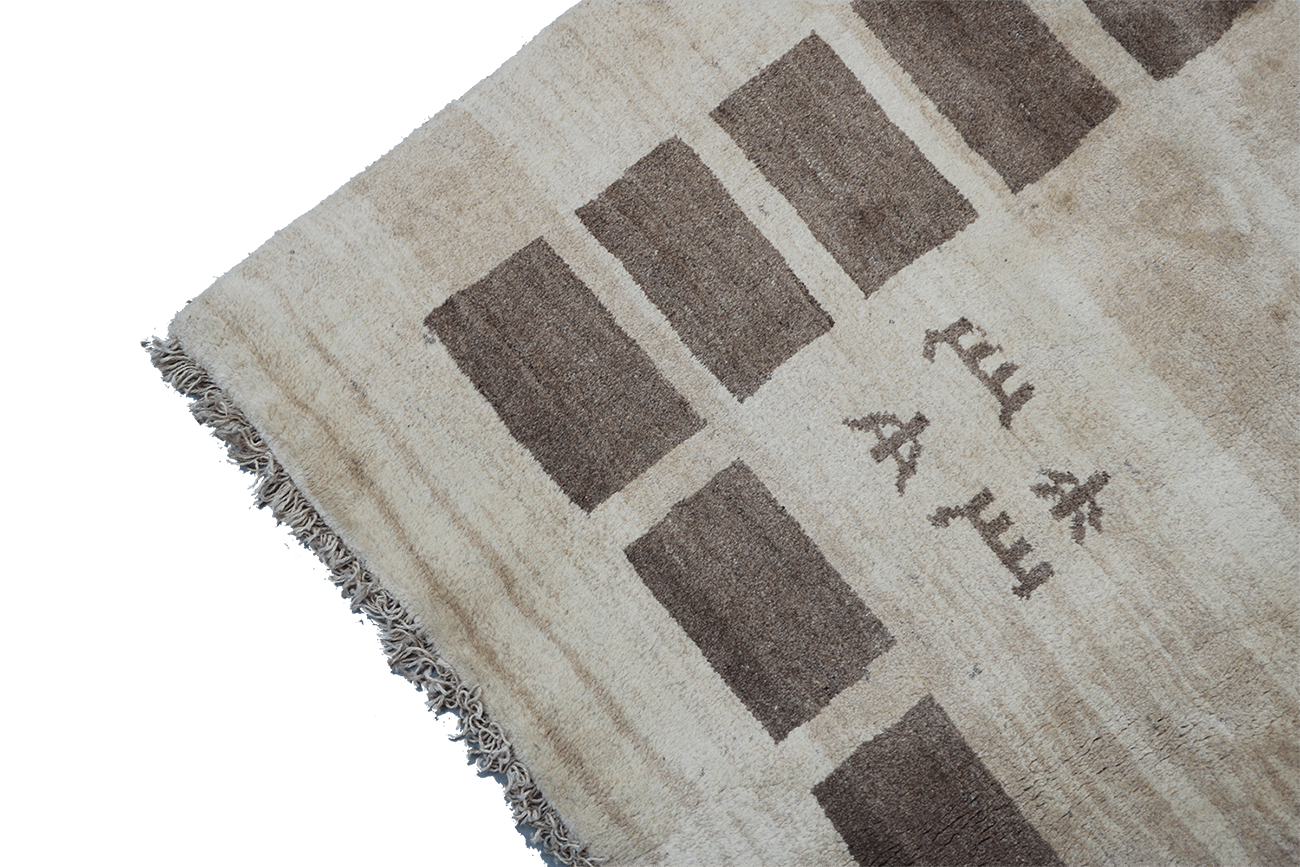 A rectangular Persian Gabbeh Tribal wool rug