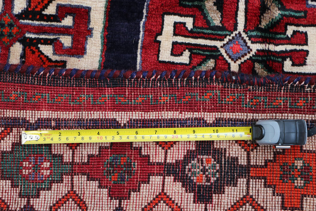 A hand-knotted Tribal Qashqai Wool Rug