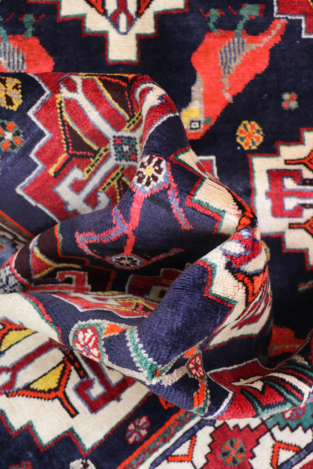 A hand-knotted Tribal Qashqai Wool Rug